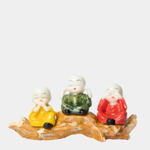 three baby buddha monks on wood branch colorful figurine set