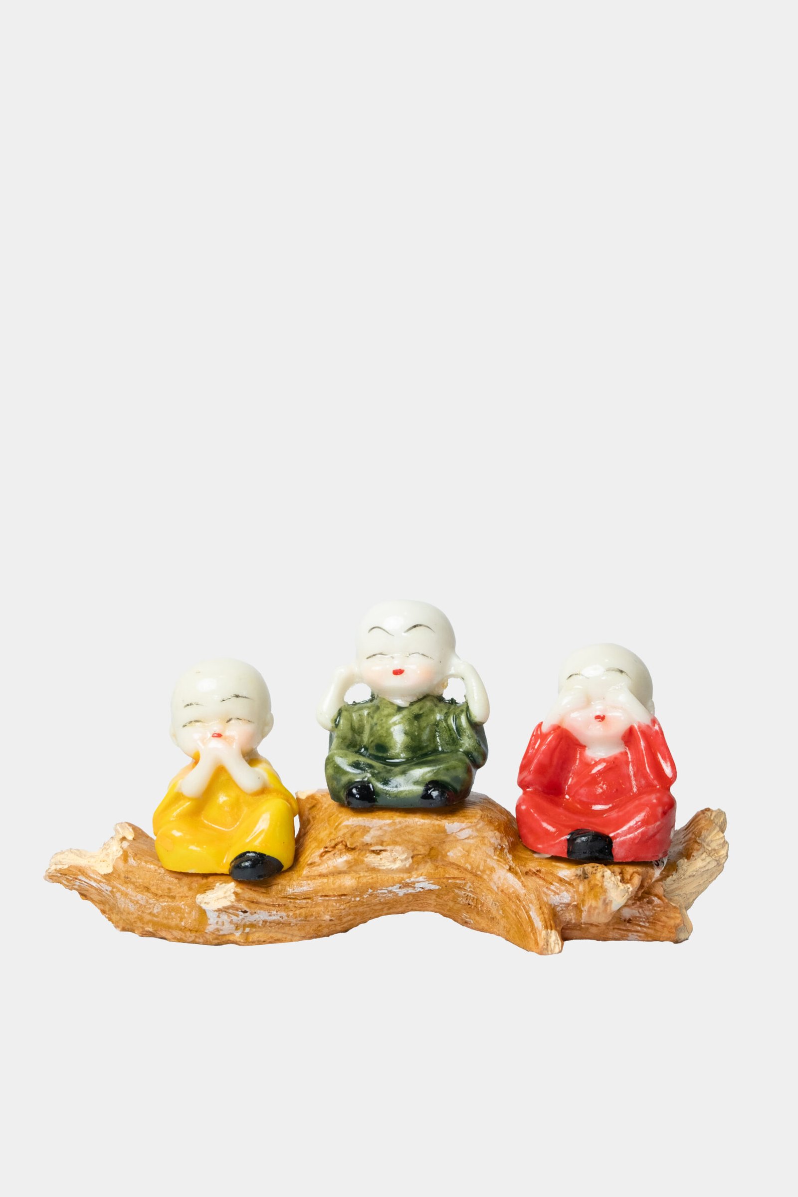 three baby buddha monks on wood branch colorful figurine set three baby buddha monks on wood branch colorful figurine set
