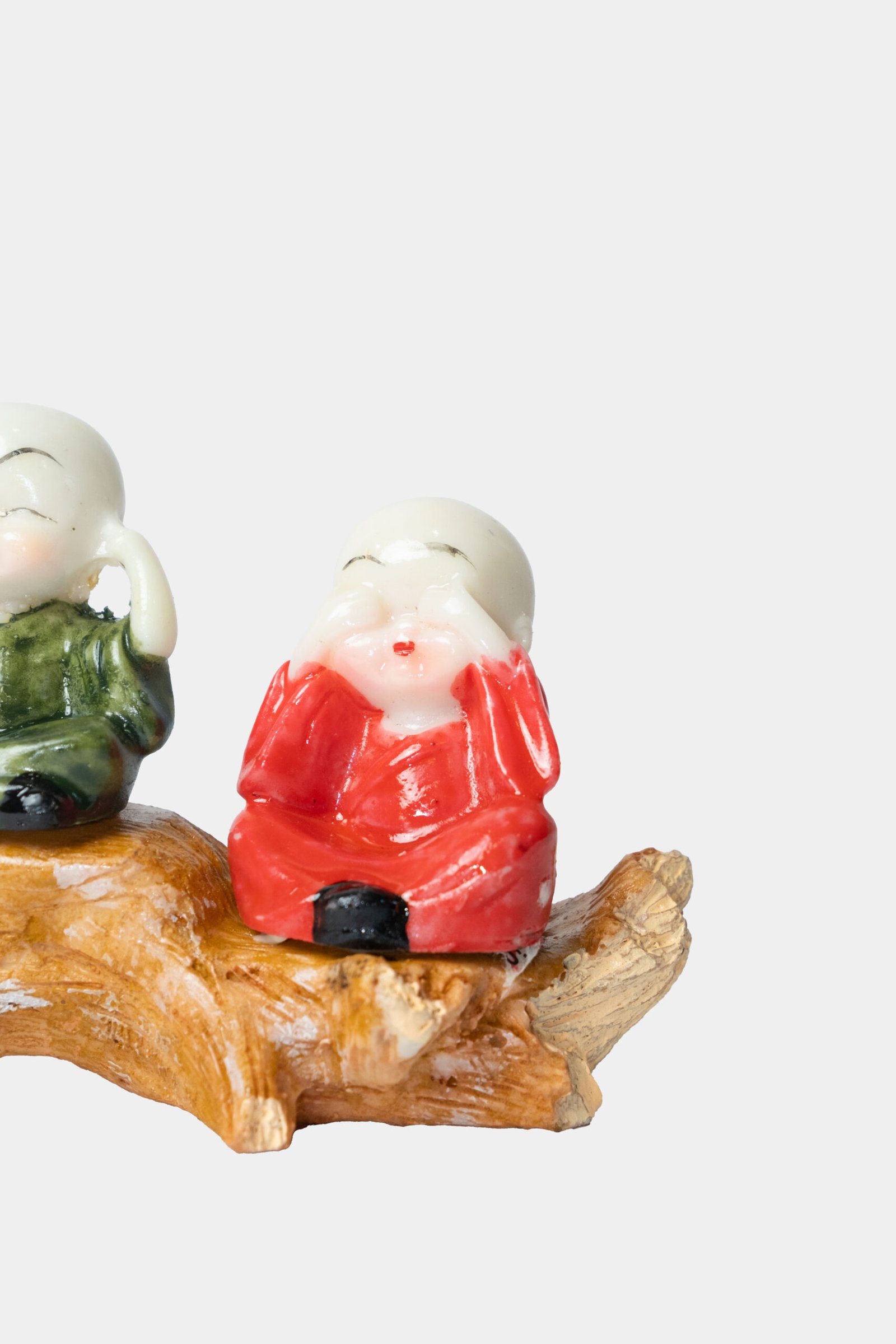 three baby buddha monks on wood branch colorful figurine set three baby buddha monks on wood branch colorful figurine set